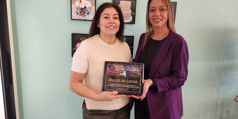 Photo (left to right): Mabel Perfecto, owner of Dulce de Leche Bakery, receives an Empire Award from State Sen. Monica R. Martinez.