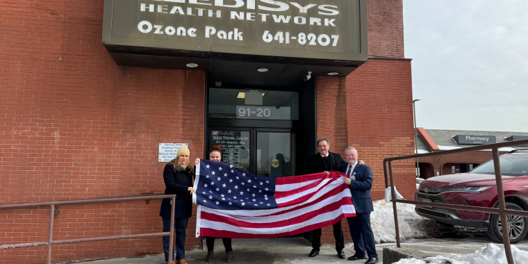 Senator Addabbo presented the flag to Patrick Rudden, manager at Jamaica Hospital, Melissa Mejias, supervisor,and Darlene Habe, practice coordinator.