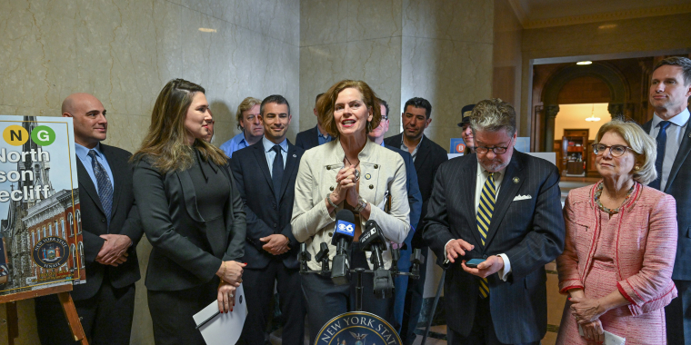 Senator Fahy standing with Senator Hinchey, Harckham, Mayer and other advocating for expanding Metro North railroad to Albany