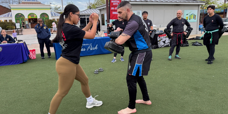 Instructor Jaylin Torres practices with Sensei Jason Lopez.
