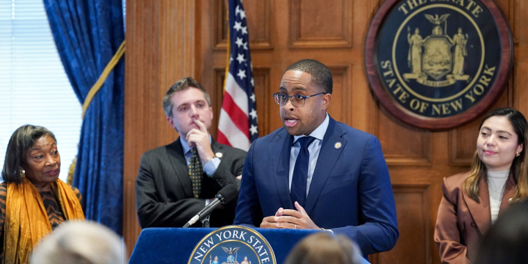 Senator Myrie at the podium discussing Esptein bill