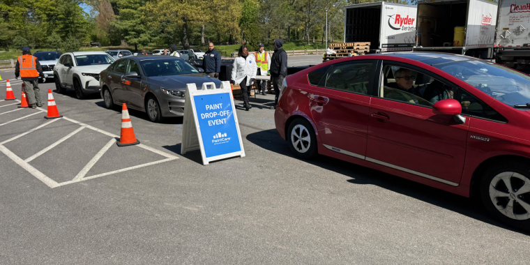 Cars lined up to drop off e-waste and paint.