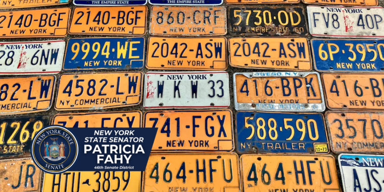 Vintage NY license plates arranged on a table
