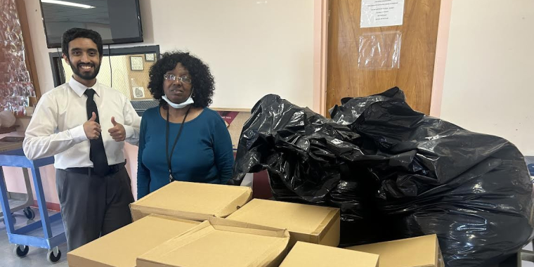 Addabbo staffers Faran Shariff, left, and Carl Moore (not pictured) dropped off the supplies with a representative for the VA.