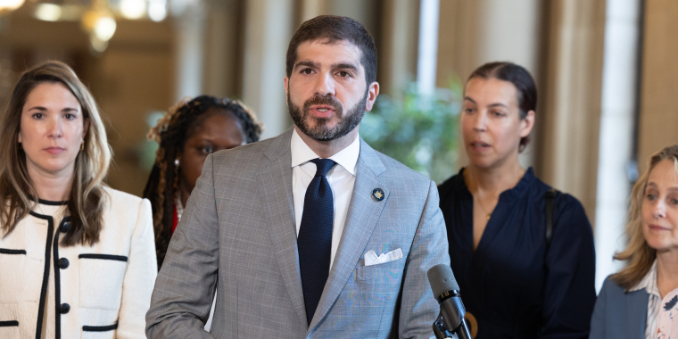 Senator Andrew Gounardes speaking at a press conference.