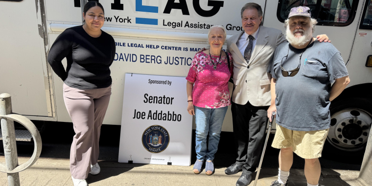 Senator Addabbo, center, is joined by Maria Barrientos, law graduate with NYLAG, left, and constituents Giuseppa Conti of Rego Park and Gary Wiegand of Middle Village outside the NYLAG van. 