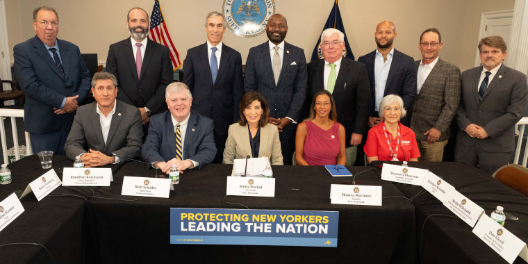 Photo image of Gov. Hochul, Sen. Martinez, business, environmental and issue advocacy leaders from Long Island at table during forum on data center development
