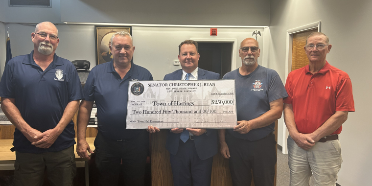 Senator Ryan presenting a check to Hastings Town Supervisor Town Bush and the Town Board