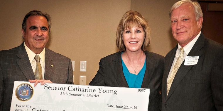 Senator Young and Assemblyman Giglio present Dr. Anthony Evans, Executive Director, Cattaraugus County Youth Bureau, with a New York State grant for $200,000 to support the Youth Bureau's mission.