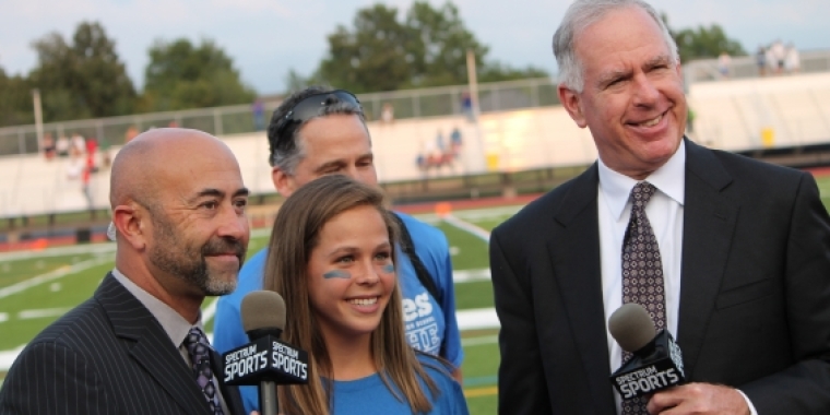 Senator Ranzenhofer and Sal Capaccio honor Williamsville student during halftime show of Friday Night Matchup.