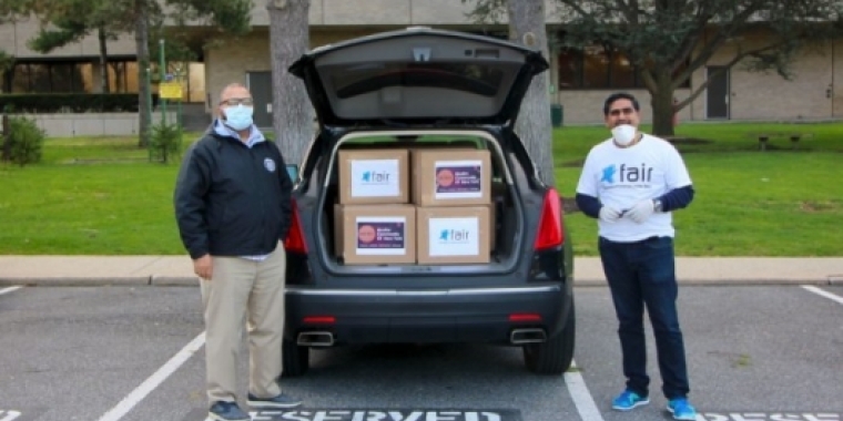 Senator Kevin Thomas, left, and Imran Pasha, Chairman of the Federation of American Indian Relief, delivered 500 N95 masks to Nassau University Medical Center last week.