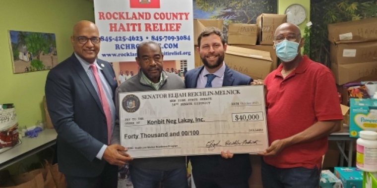 Senator Reichlin-Melnick delivered $40,000 to Konbit Neg Lakay