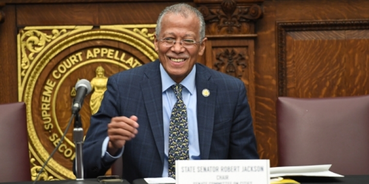 Senator Jackson gives a thumbs up during a light moment at a hearing in Brooklyn