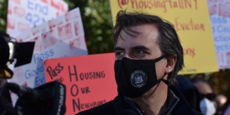 Senator Gianaris at a protest supporting tenants