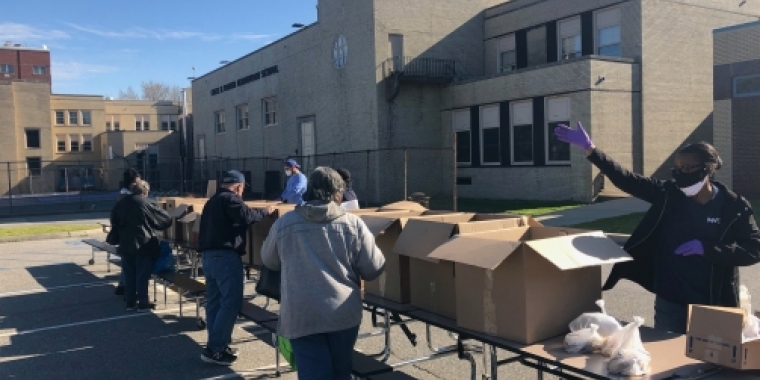 Volunteers working to package and deliver meals
