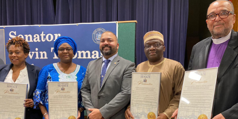 Senator Kevin Thomas, center, presenting New York State Senate Proclamations to (from the left) Detective Sergeant Ieda McCullough, Isoken Irowa, Uhumwnamure Lucky Irowa, and Apostle J. Raymond “Megalos” Mackey, I. Senator Kevin Thomas, center, presenting New York State Senate Proclamations to (from the left) Detective Sergeant Ieda McCullough, Isoken Irowa, Uhumwnamure Lucky Irowa, and Apostle J. Raymond “Megalos” Mackey, I.