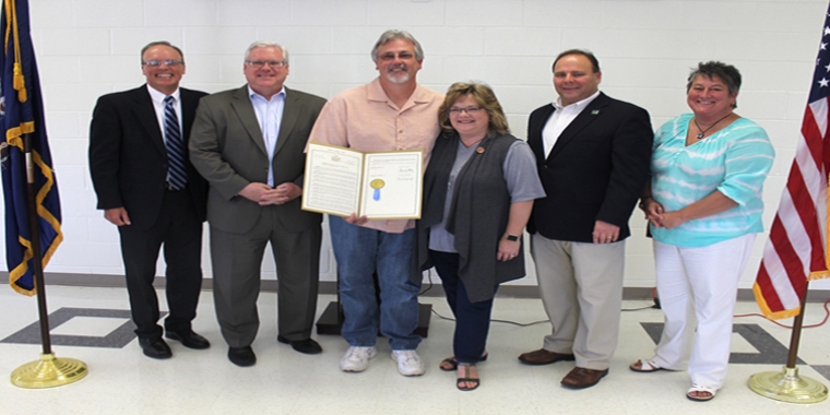 At a celebration at the GST BOCES Coopers Campus on Friday, June 9, from left to right: GST BOCES Executive Director for Career and Technical Education (CTE) Programs Chris Weinman, Senator O'Mara, Dale Robie, Dale's wife Dori, Assemblyman Palmesano, and CTE Principal Colleen Hurd.