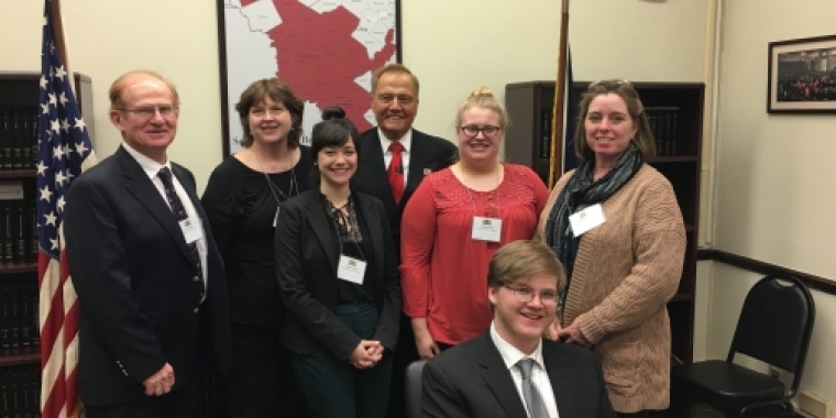 Senator Bonacic is pictured with (L-R), John Lupinski, Diane Lupinski, Megan Conroy, and Andrew Lupinski (seated) of the Orange County Farm Bureau and Jaclyn Kimmes and Shannon Budnik of the Sullivan County Farm Bureau.
