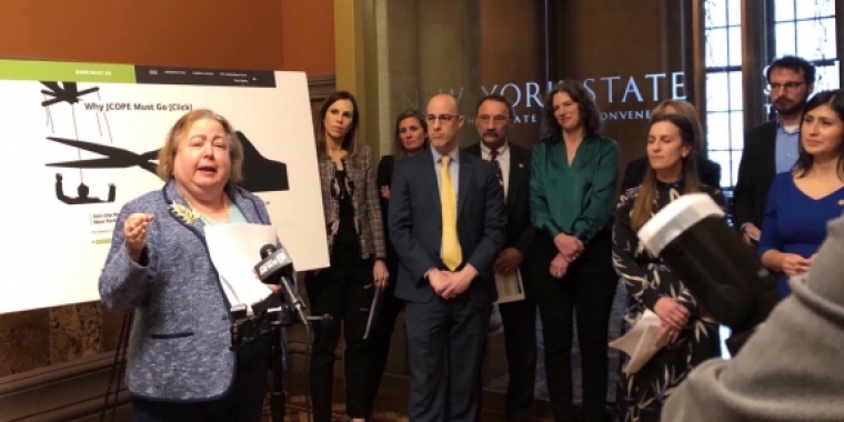 Sen. Krueger speaking at a press conference