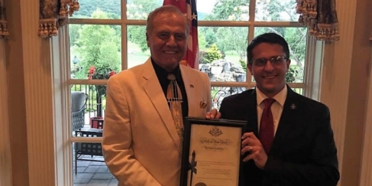 Senator Bonacic presents a framed pen certificate to Ulster County Legislature Chairman Ken Ronk.