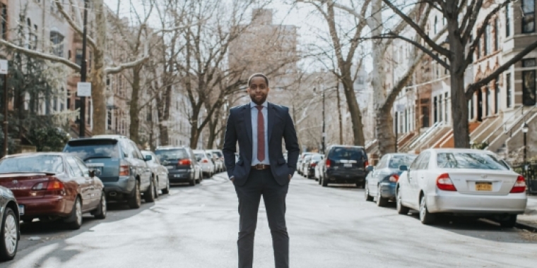 Image of Senator Myrie on a residential street in the 20th District. 