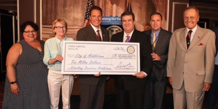 The City of Middletown is presented with a ceremonial $10 million check from the State of Nw York. Pictured L-R are, NY Secretary of State Rossana Rosada, Assemblywoman Aileen Gunther, Governor Andrew Cuomo, City of Middletown Mayor Joseph DeStefano, Orange County Executive Steve Neuhaus, and Senator John Bonacic. (Photo courtesy of the Office of Andrew M. Cuomo)