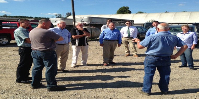 David Covert (foreground) of Damin Farms, LLC, a large family dairy and corn farm in Prattsburgh, Steuben County discusses the impact of the drought with Sen. O'Mara and other state and local officials.