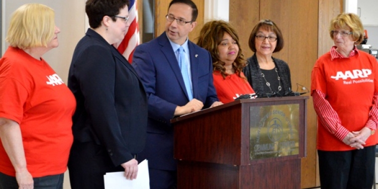 State Senator Joseph Griffo, R-Rome, looks toward AARP Associate State Director Laura Palmer to his left, as well as several local members of AARP, as he announced at the North Utica Senior Citizen Community Center on Tuesday, Feb. 23, 2016, new legislation he is sponsoring that would seek to double fines against telemarketers who continue to violate the National Do Not Call Registry.