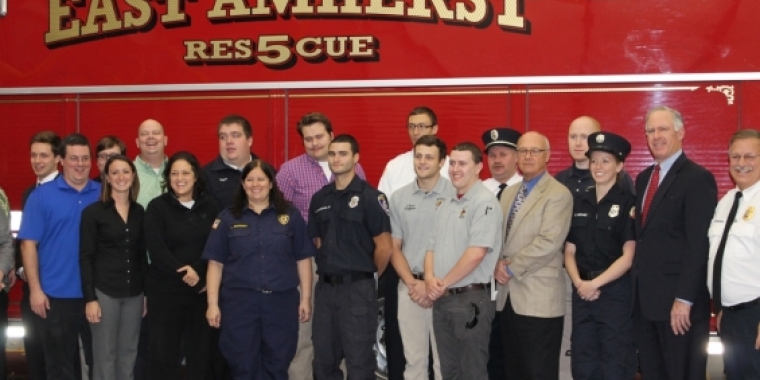 Senator Ranzenhofer poses for a picture with the graduates.