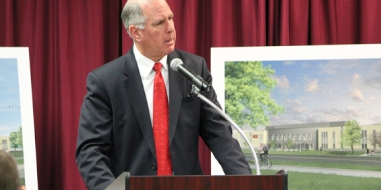 Senator Ranzenhofer congratulates ECC President Jack Quinn at a press conference revealing plans for the new building.