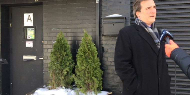 Senator Gianaris stands in front of the gentlemen's club Aces to call for its immediate shutdown