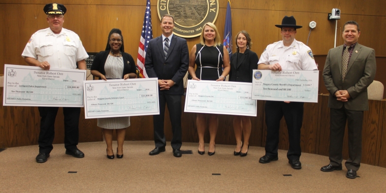 Pictured at the Lockport Police Dept. from left to right: Lockport Police Chief Michael Niethe; Niagara County Veterans Court Representative Nina Cabrera; Senator Rob Ortt; Niagara County DA Administrative Assistant Dona Chase; Deputy District Attorney Doreen Hoffmann; Niagara County Sheriff’s Chief Deputy Michael Dunn; and Lockport Common Council Chairman David Wohleben.