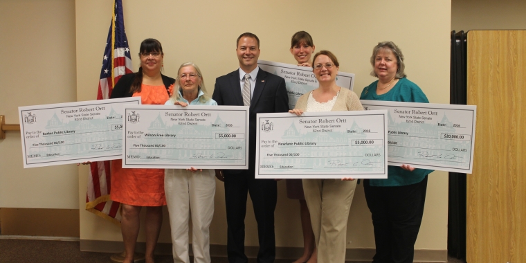 Pictured at the Lockport Public Library from left to right: Barker Library Director Lisa Thompson; Wilson Library Dir. Marge Clark; Senator Ortt; Royalton-Hartland Library Dir. Sonora Miller (back row); Newfane Library Dir. Kris DeGlopper-Banks; and Lockport Library Dir. Bev Federspiel.
