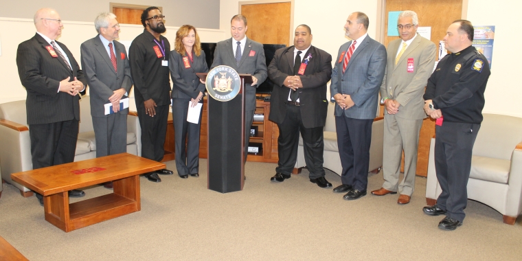 Pictured from left to right: Pat Bradley, Public Relations & Communications Director at Niagara Falls Memorial Medical Center; Dan Shubsda, Pres./CEO, Northpointe Council, Inc.; Marlon Thornton, Director of Quality Assurance at Northpointe Council; Laura Kelemen, Niagara County Director of Mental Health; Senator Rob Ortt; Owen Steed, Niagara County Legislator; Mark Laurrie, Niagara Falls City School District Superintendent; Avi Israel, Save the Michaels of the World, Inc. Pres.; and Bryan DalPorto, Niagara Falls Police Superintendent.