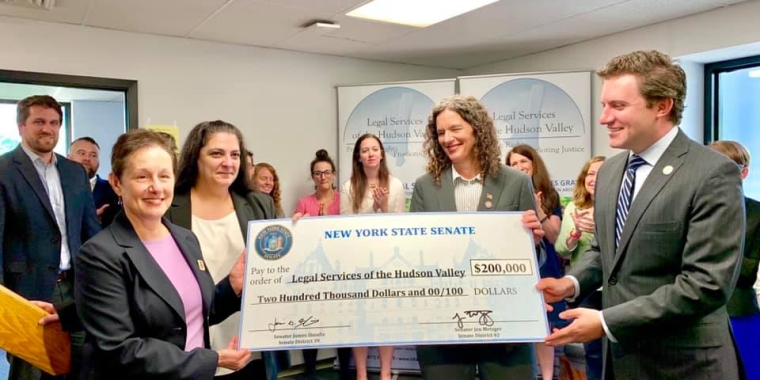 Senators Skoufis and Metzger present check to Legal Services of the Hudson Valley