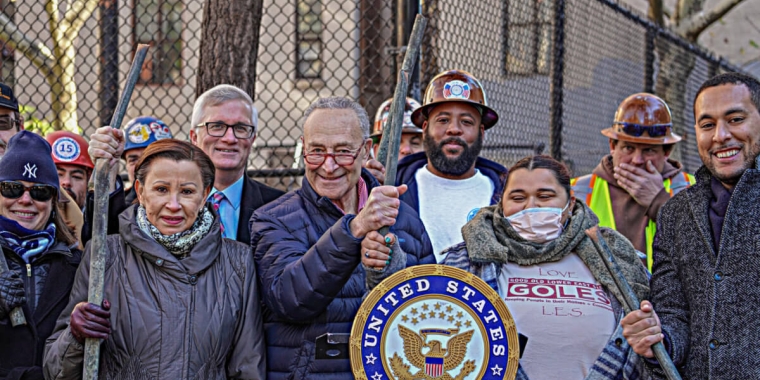 Senate majority leader Chuck Schumer and fellow elected officials hold up pipes on Nov. 24 to symbolize lead removal. Photo by Dean Moses