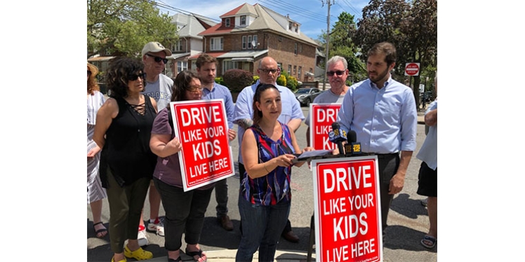 Denise Cangemi (at podium), a member of the Southern Brooklyn Pedestrian Safety Task, said it’s not safe to cross the street. At right is state Sen. Andrew Gounardes, who formed the task force.