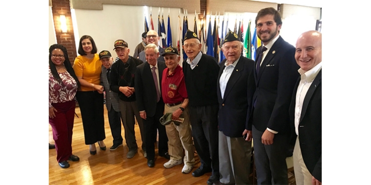 Elected officials pose with the five World War II veterans at Fort Hamilton Army Base Veterans Day observance.