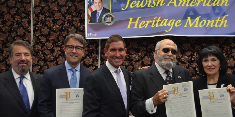Photo caption: Senator Jeff Klein is joined by David and Jay Katz, the grandchildren of the late Blanche Comras Rifkin, Charles Landsberg, and Arlene Salman.