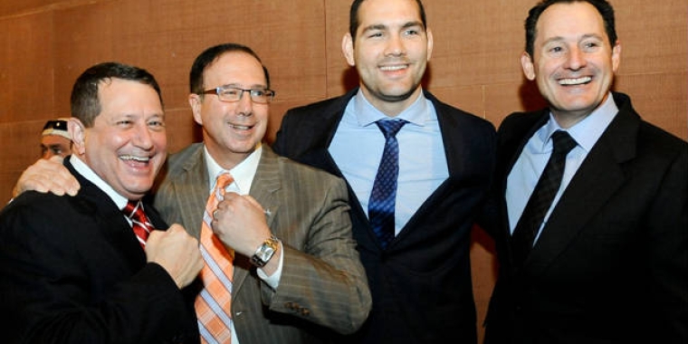 From left: Assemblyman Joe Morelle, Senator Joseph Griffo, former UFC middleweight champ Chris Weidman and UFC Chief Operating Officer Lawrence Epstein in Albany on Jan. 26, 2016