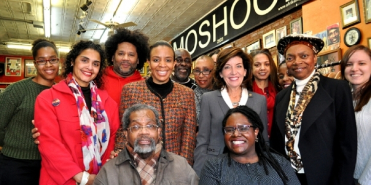 LG Kathy Hochul at Moshood in Ft. Greene. Participants included, starting from back row L: Deputy Boro President Diana Reyna (2nd from L); Jamel Gaines, Creative Outlet Dance Theater; NYC Councilwoman Laurie Cumbo; Moshood; Brenda Brunson Bey of Tribal Tents; NYS Lieutenant Governor Kathy Hochul; Dr. Indira Etwaroo, Executive Director, Bedford Stuyvesant-Restoration Center for Arts and Culture; Sabine LaFortune, Director of Operations, Bedford Stuyvesant-Restoration Center for Arts and Culture; NYS Senator Velmanette Montgomery; Representatives of Weeksville Heritage Center (seated) LG Kathy Hochul at Moshood in Ft. Greene. Participants included, starting from back row L: Deputy Boro President Diana Reyna (2nd from L); Jamel Gaines, Creative Outlet Dance Theater; NYC Councilwoman Laurie Cumbo; Moshood; Brenda Brunson Bey of Tribal Tents; NYS Lieutenant Governor Kathy Hochul; Dr. Indira Etwaroo, Executive Director, Bedford Stuyvesant-Restoration Center for Arts and Culture; Sabine LaFortune, Director of Operations, Bedford Stuyvesant-Restoration Center for Arts and Culture; NYS Senator