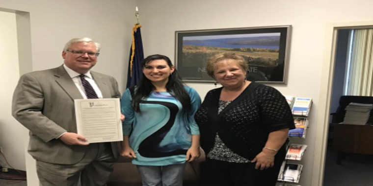 In Senator O'Mara's district office in Elmira on Wednesday, the senator and Robin DeLong of GST BOCES present Amna Gafsi of Horsheads with a Legislative Proclamation commending her achievement.