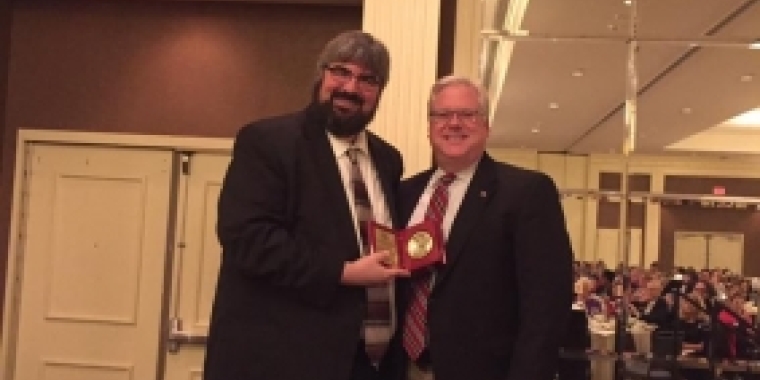 Senator O'Mara receives the 2016 "Outstanding Advocate for Libraries Award" from 2016 NYLA Awards Chair and Immediate Past President Geoffrey Kirkpatrick.