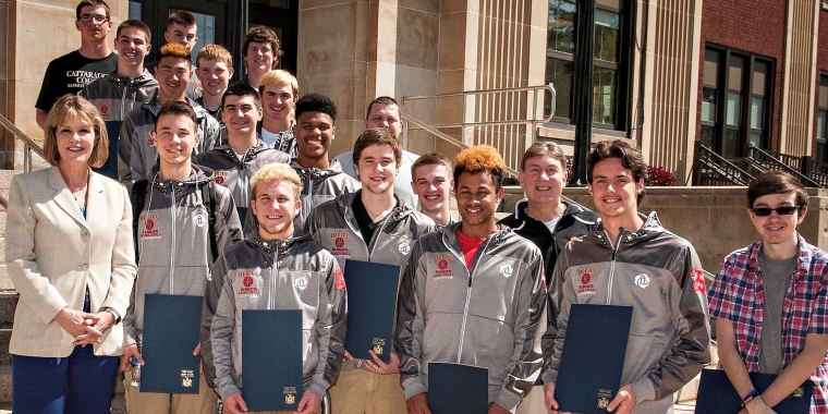Senator Young presents New York State Senate Resolutions to members of the State Champion Olean Huskies Boys Basketball Team.