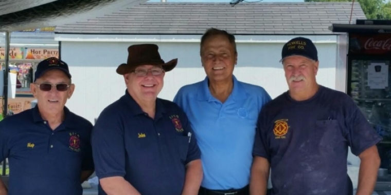 Senator Bonacic is pictured with members of the Howells Fire Company, who volunteered to serve food at the Fair.
