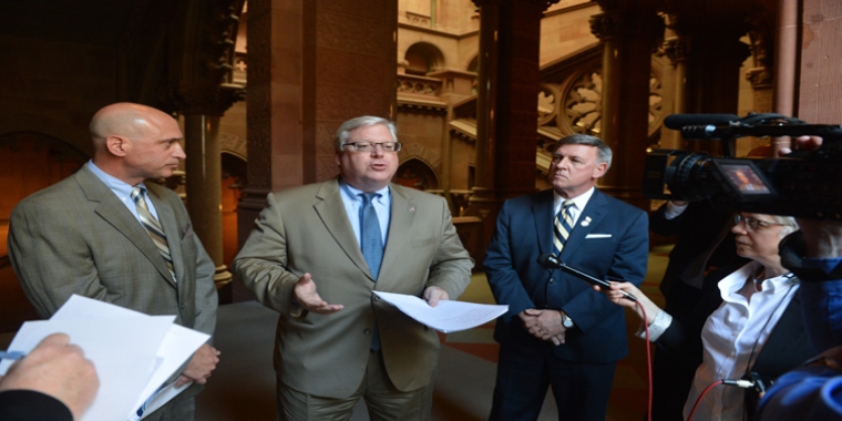 NYSAC Executive Director Stephen Acquario (l.), Senator O'Mara and Senator Rich Funke express support for the paint recycling legislation.