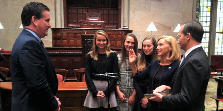 Senator Phillips is sworn-in to the New York State Senate by Senate Majority Leader John Flanagan. She is joined by her husband, Andy, and daughters Sarah, Kate and Hannah.