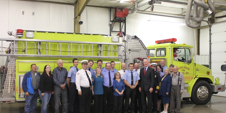 Senator Ranzenhofer and members of the South Byron Volunteer Fire Company pose for a picture in front of the 20-year-old fire truck being replaced.