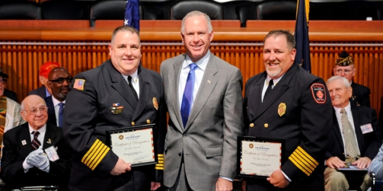 Senator Ranzenhofer honors Thomas R. Wood Sr. and William Charles Wood III for their service in the United States Marine Corps. and in the community during an induction ceremony at the State Capitol.