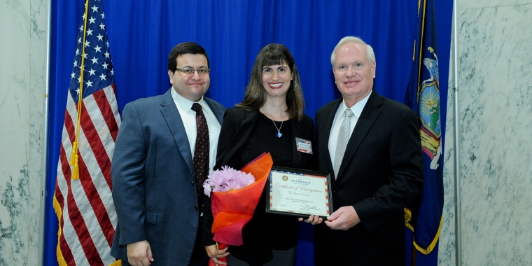 Captain Diacosavvas is joined by her husband (l.) and Senator Tony Avella (r.)